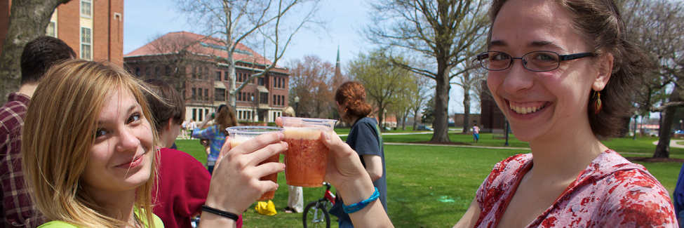 Students sample organic juices at the annual Earth Week Festival.