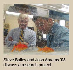 Steve Bailey and Josh Abrams '03 discuss a research project.