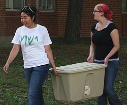 Students move their belongings