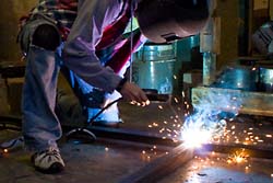 Sam Newport '10 welding the pageant wagon