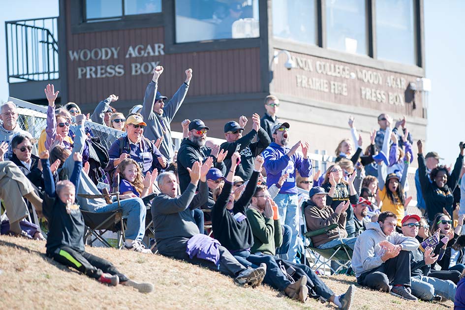 Alumni and fans cheer on the Prairie Fire football team during Homecoming 2015.