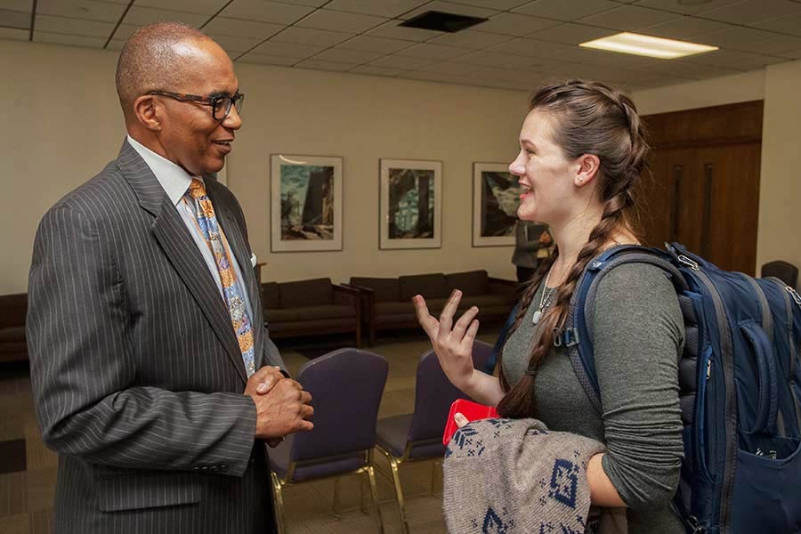 Student Celina Pedit '17 speaks with Dan Taylor after luncheon