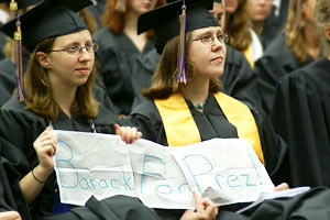 Knox graduates Sarah Lammie '05 and Sarah Legowski '05 hold a sign that reads "Barack for Prez!"