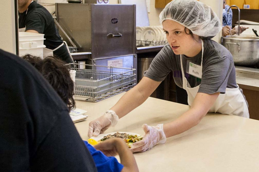 Students and recent graduates in the KnoxCorps program engage in community service at non-profit organizations.