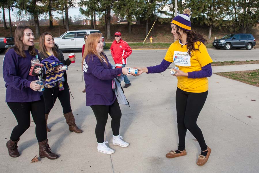 Knox College football fans donate canned goods at the 2015 Bronze Turkey game.