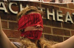 A student protests before the lecture of former U.S. Attorney General John Ashcroft on the Knox College campus.