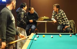 Students play pool in Taylor Lounge and Game Room