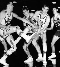 Bill Fuerst ’69, third from left, and teammates tangle with Monmouth players during the last game of the 1967 season.