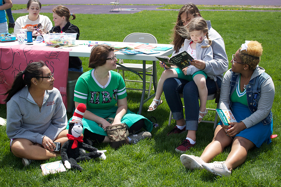 Ladies from the Pi Beta Phi sorority spread literacy awareness by reading books to children. 