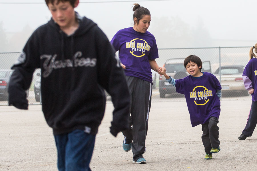 The Knox College men's and women's tennis teams lead a fitness program for local grade school kids.