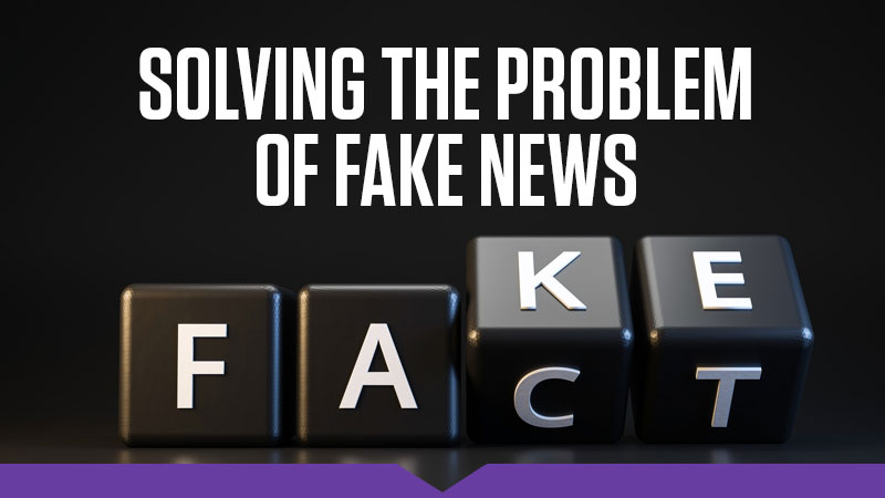 Solving the Problem of "Fake News": A set of alphabet cubes pause in mid-turn between the words "Fake'" and "Fact"