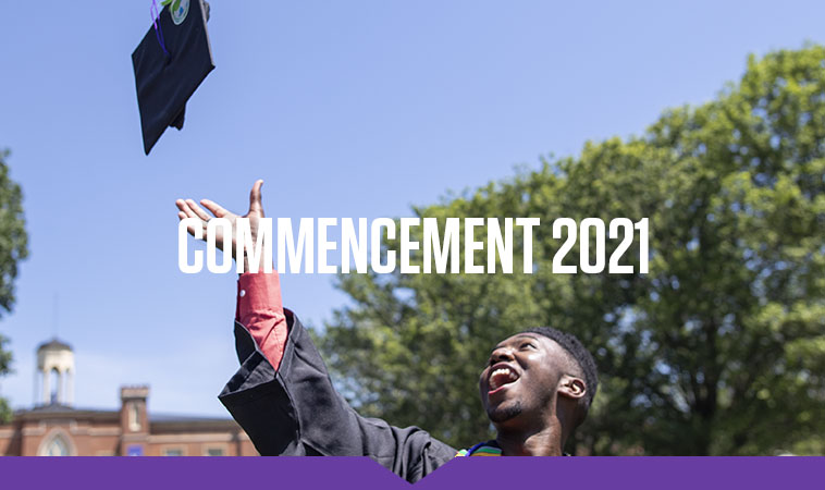A smiling member of the Class of 2021 tosses his mortarboard toward blue skies after receiving his degree.
