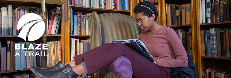 A Knox College student studies in Seymour Library