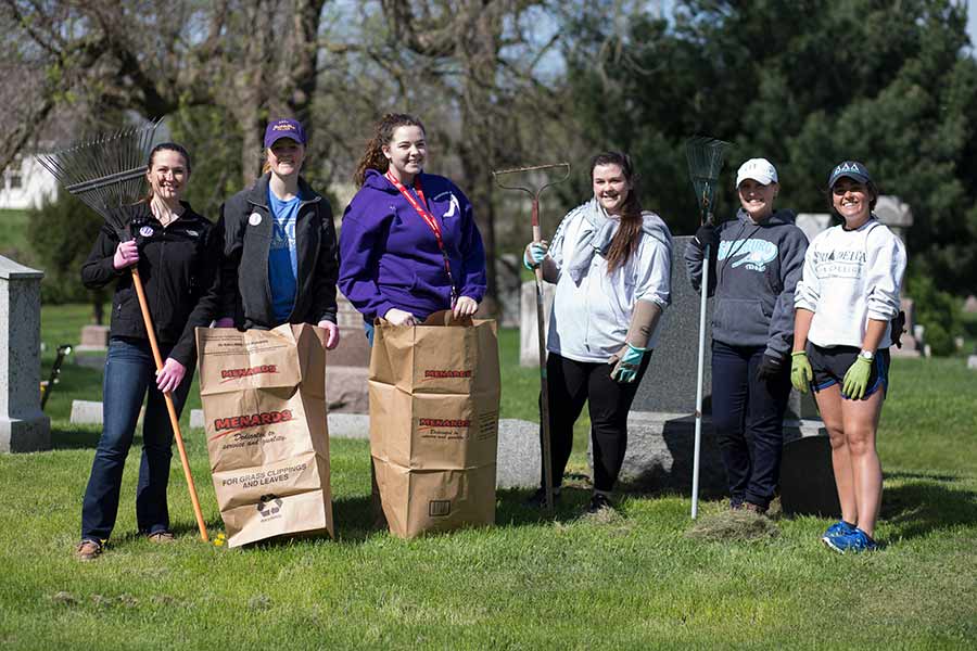 Students volunteer to restore Hope Cemetery for Knox College's Day of Service.