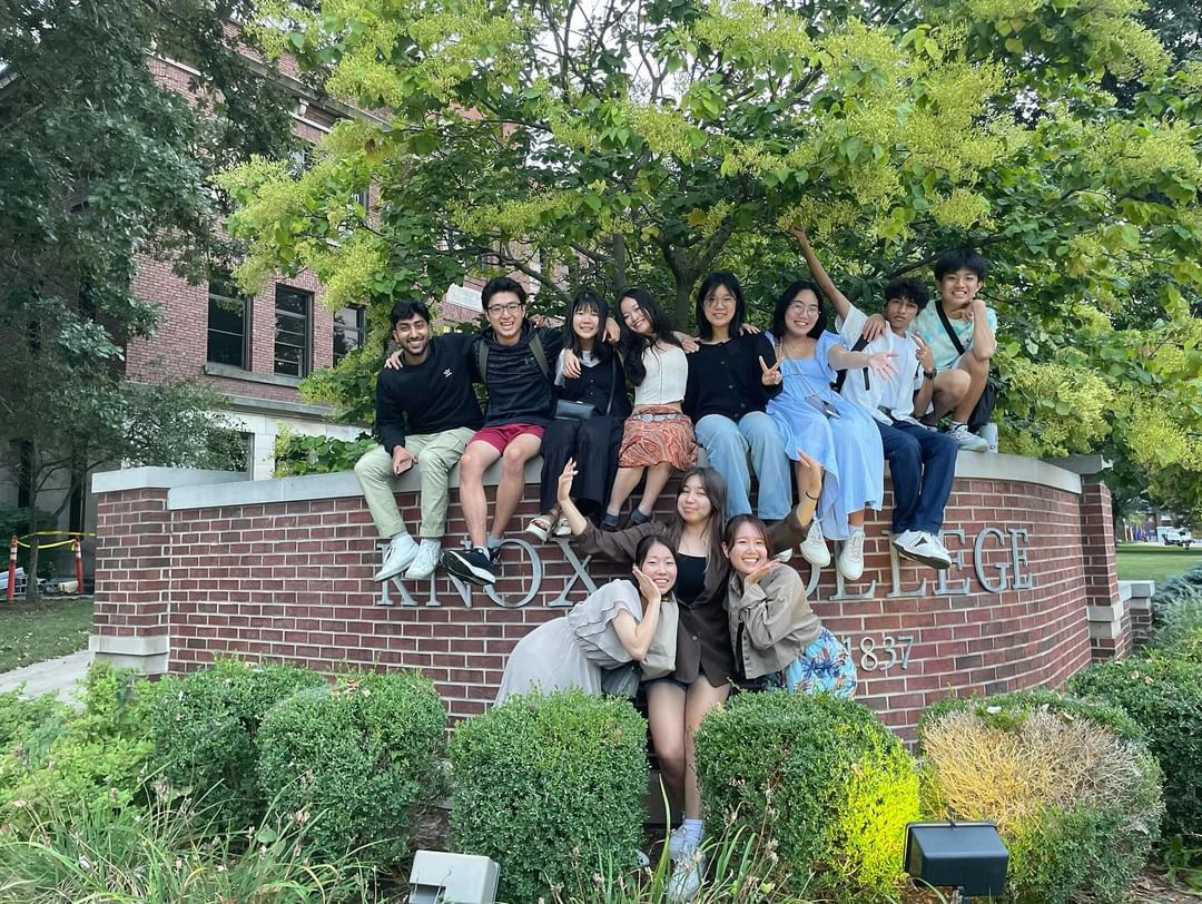 students posing outside the George Davis Hall