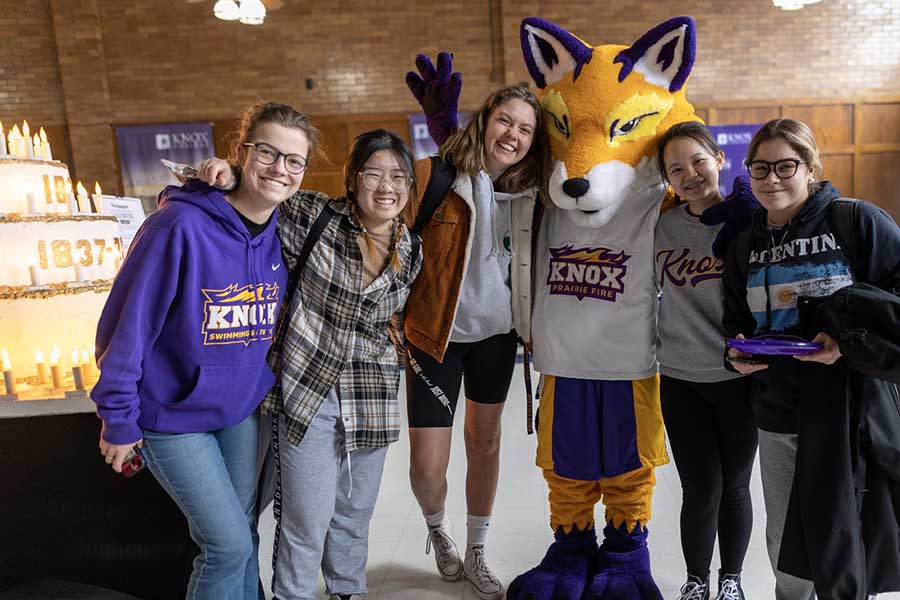 Knox Students with Blaze in front of the Wooden Cake