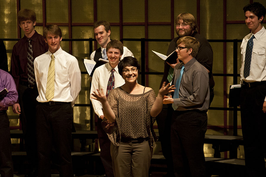 Abbie Betinis greets the audience at a Knox College Choir concert last spring that featured one of her works.