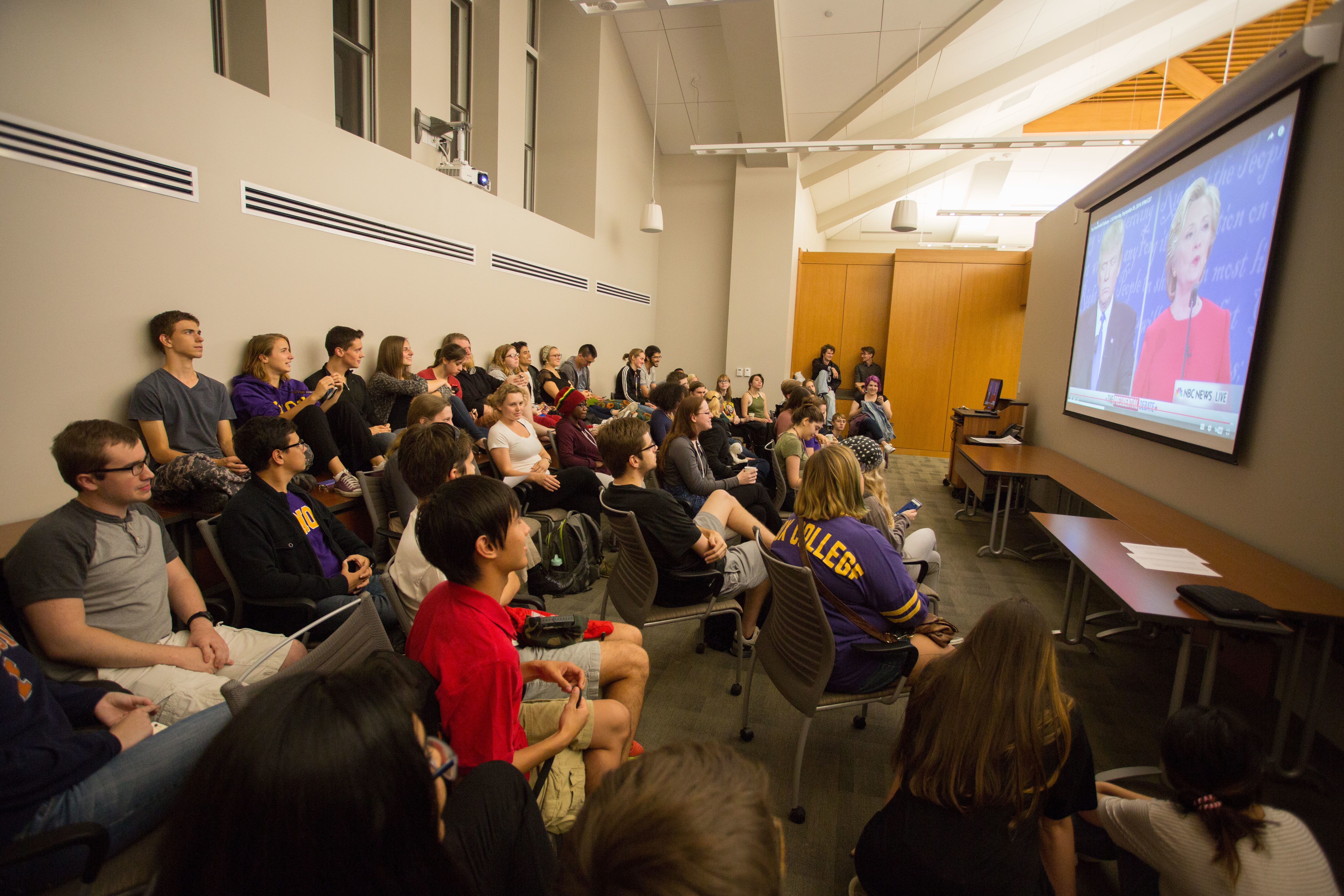 Students gather to watch the Clinton - Trump Presidential Debate on big-screen TVs in Alumni Hall.