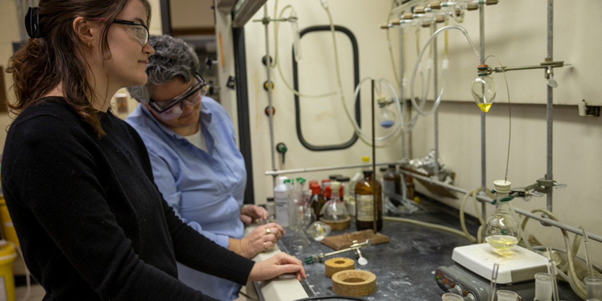 Diana Cermak with student in chemistry lab