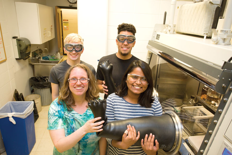 Students pose in chemistry lab