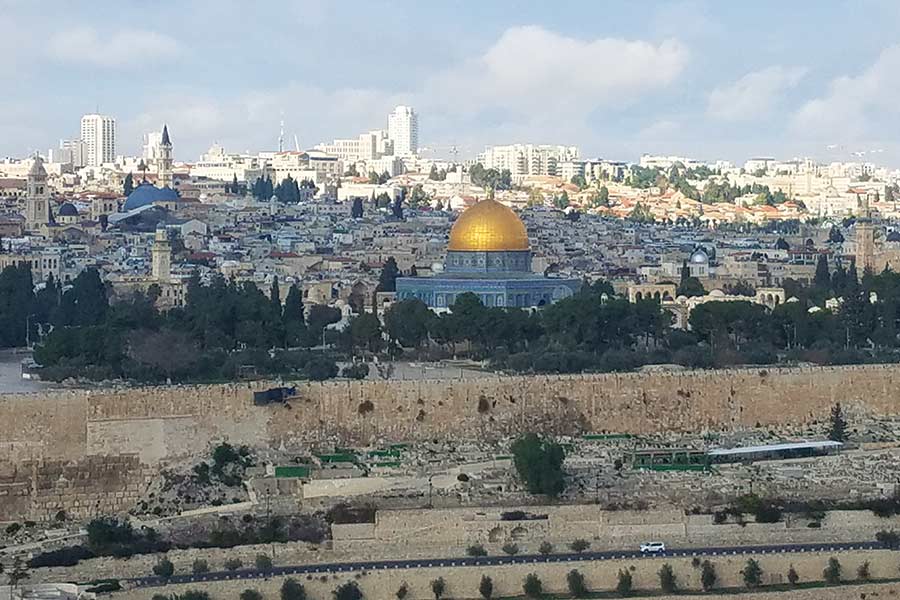 The Dome of the Rock gleams from within the Old City of Jerusalem. The stone the temple was built atop holds great significance both for Jews—who believe it is the place where Abraham once tried to sacrifice his son—and for Muslims, who believe it is the spot where the Prophet Muhammad ascended to heaven.