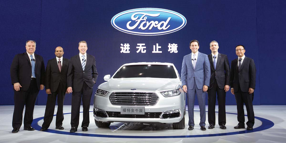 John Lawler (second from right) helps to introduce the new Ford Taurus at the 2015 Shanghai Auto Show alongside members of Ford's global development team.