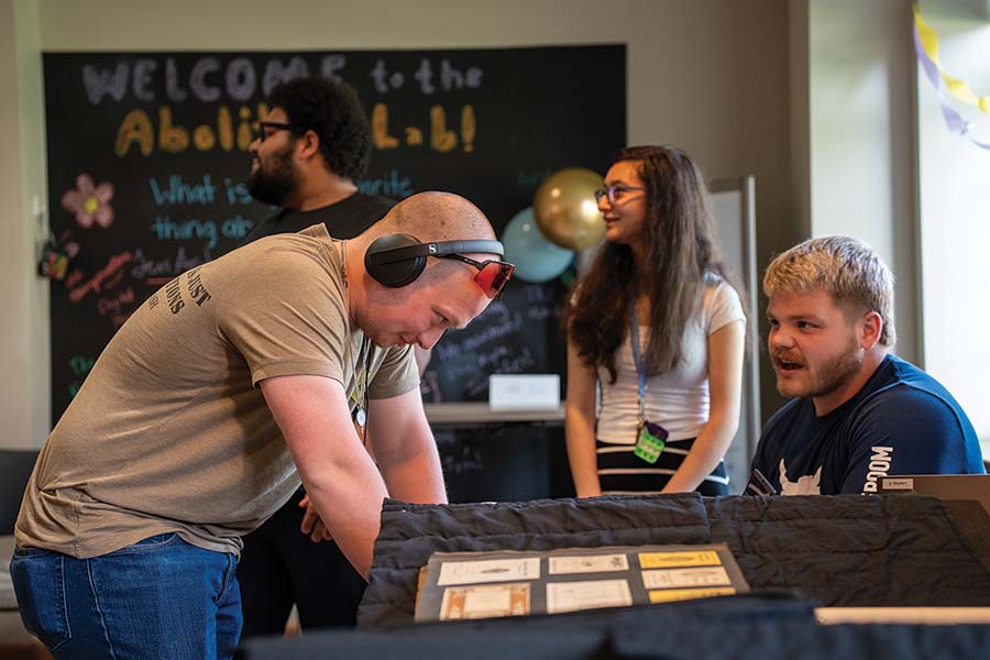 A group of four students work in the Abolition Lab.