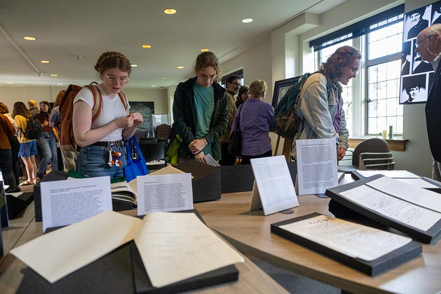 Knox students and friends explore the Knox in the 1960s exhibit that accompanied the Anderson House program. 