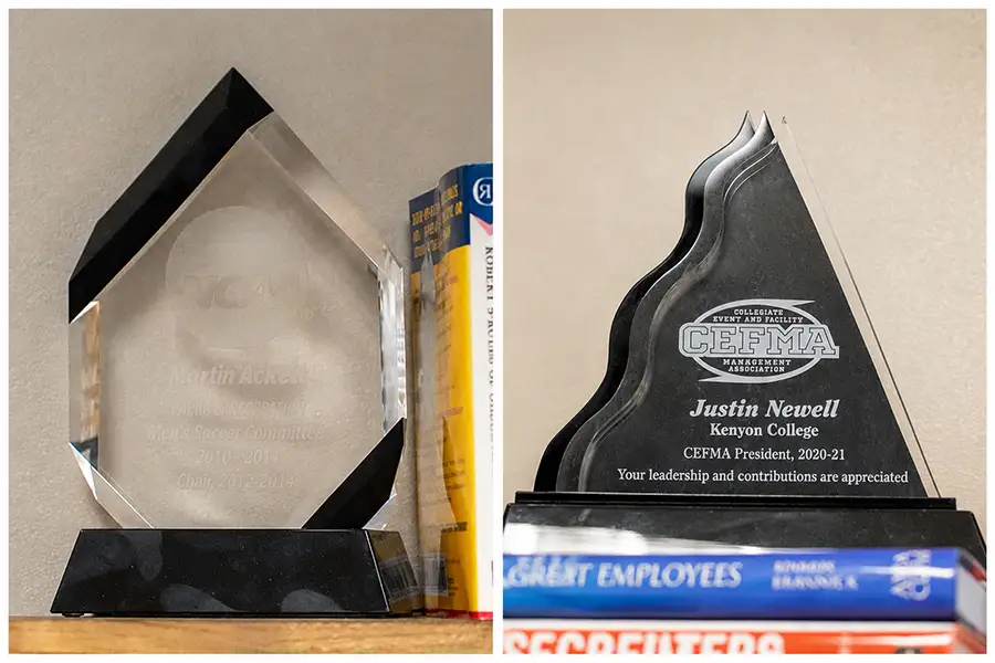 Two awards sit on a shelf.