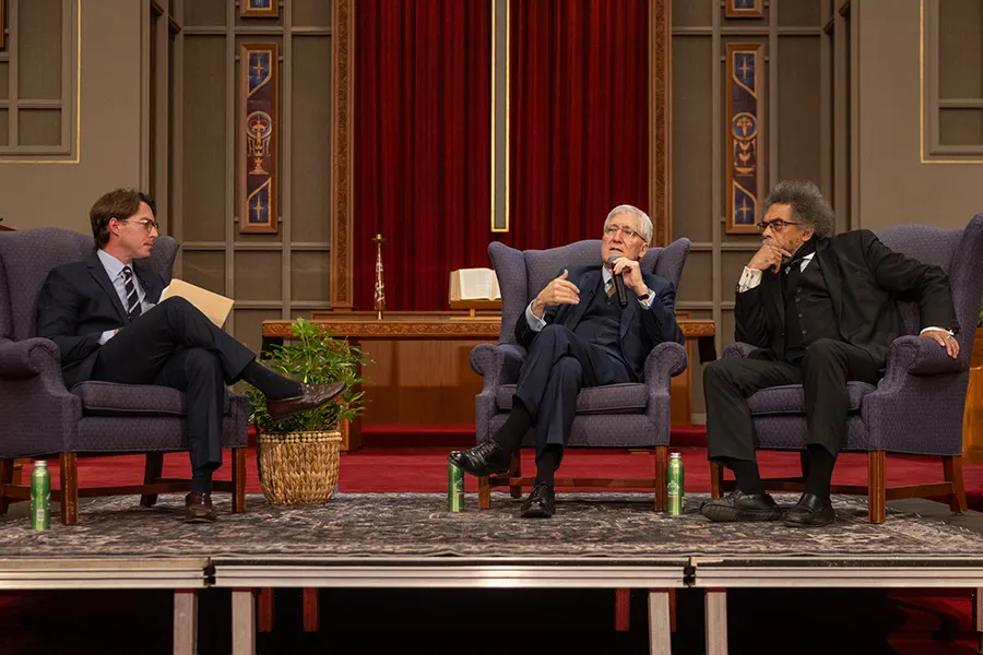 Associate Professor of Political Science Thomas Bell (left) moderates a discussion with renowned scholars Robert P. George (middle) and Cornel West (right).