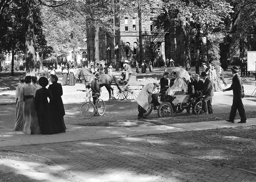 The 1957 movie, Those Were the Days, being filmed on the Knox College campus. Old Main is in the background, and horses and buggies, plus students in early 1900s dress, are in the foreground.
