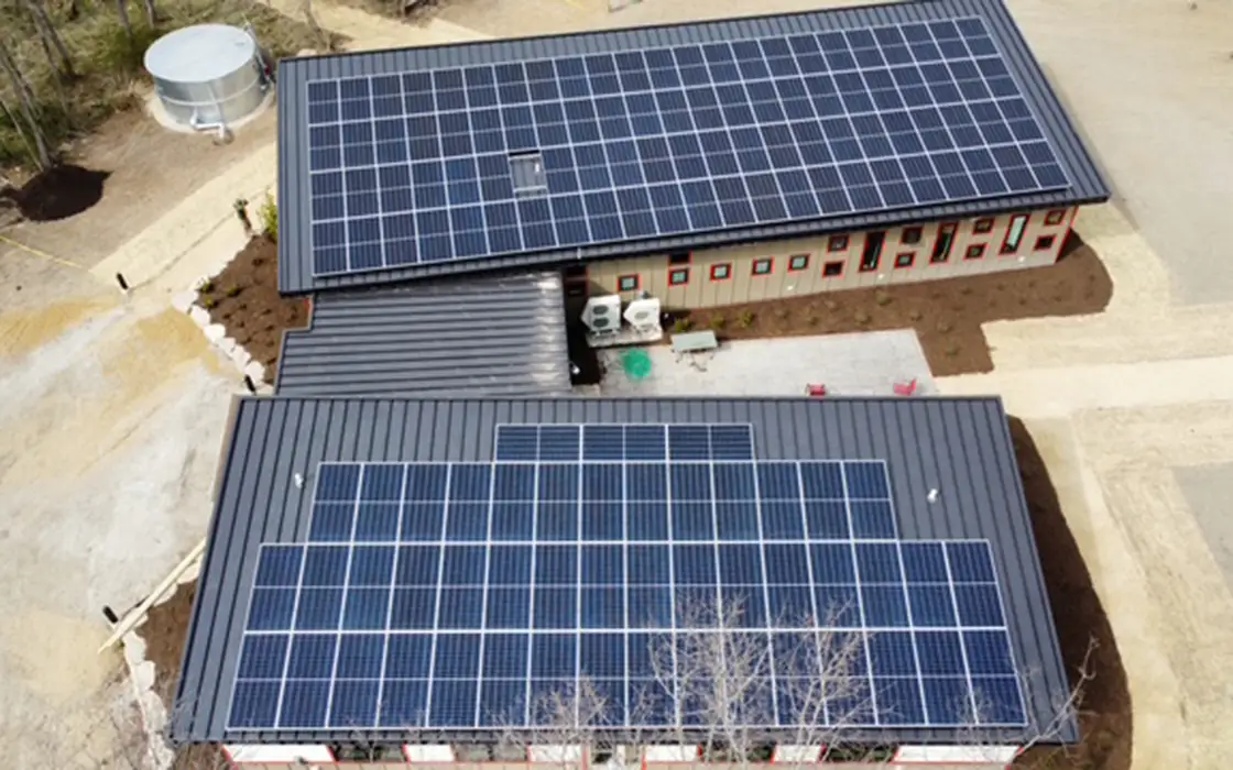 Aerial view of the Knight Living and Learning Center at Green Oaks. Solar panels are visible on the roof. 