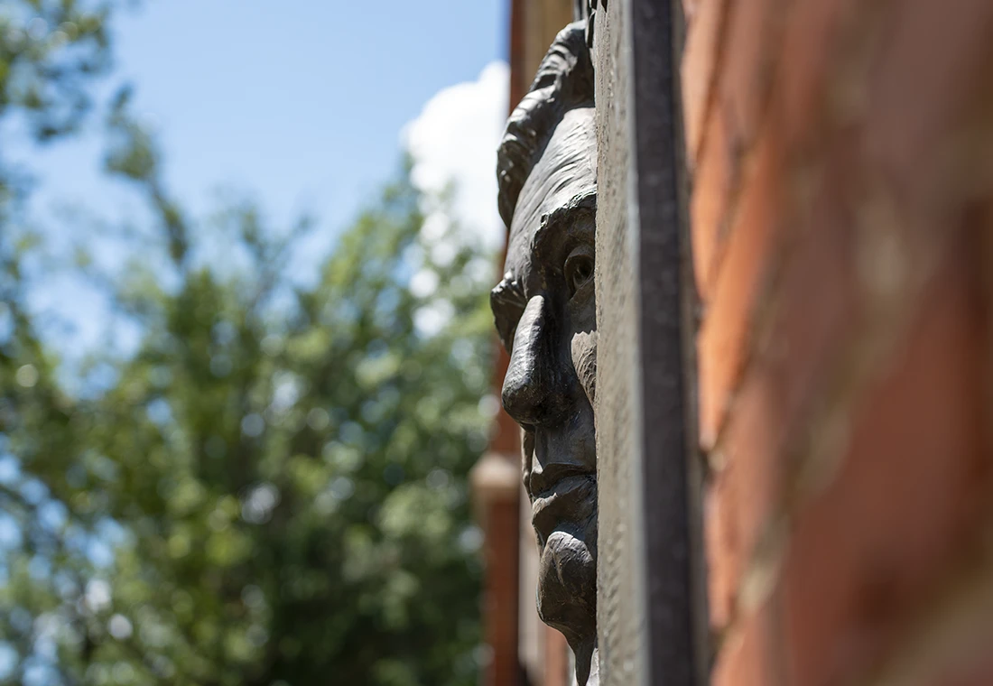 A relief of Abraham Lincoln on the side on Old Main, site of the 1858 Lincoln-Douglas Debate.