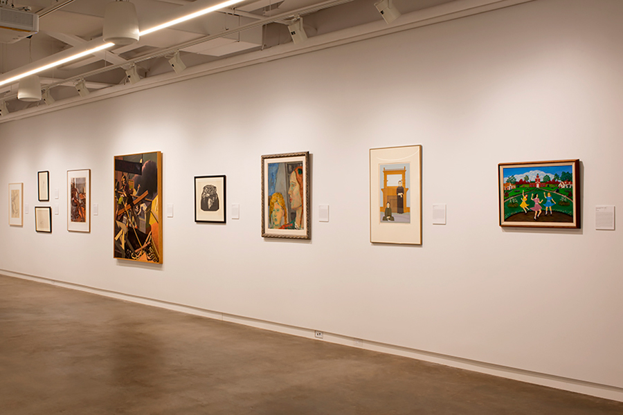 Works of art hang on the wall in an art gallery.