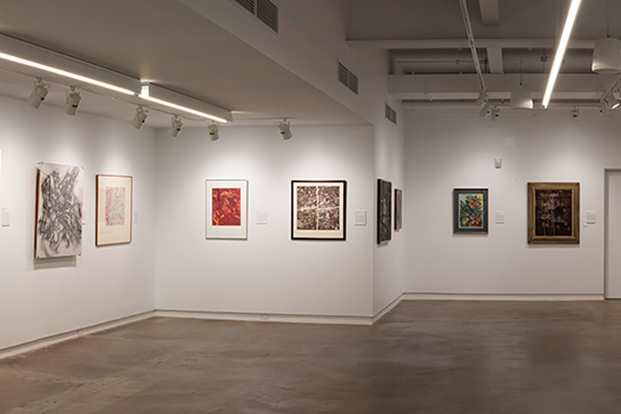 Works of art hang on the wall in an art gallery.