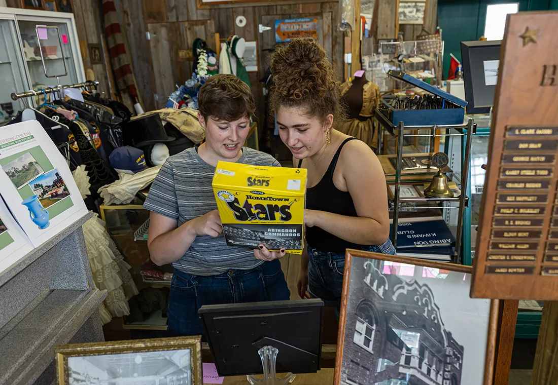 Two students look at artifacts in the Abingdon Museum.