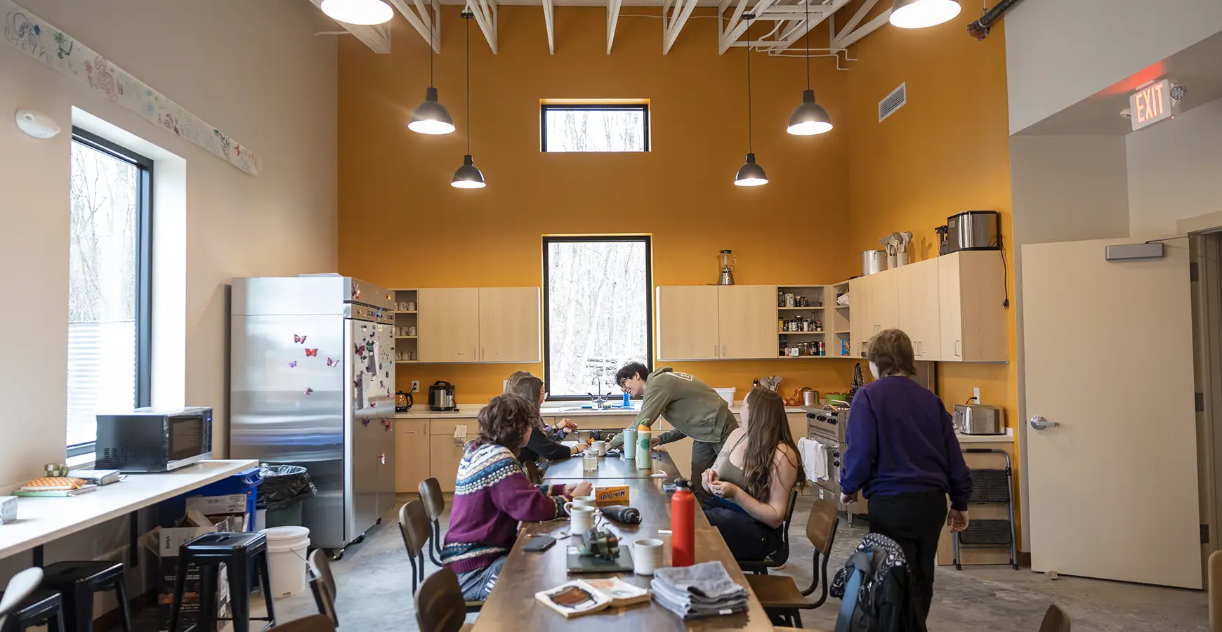 Members of the Green Oaks Term gathered in the kitchen  at the Knight Living & Learning Center.