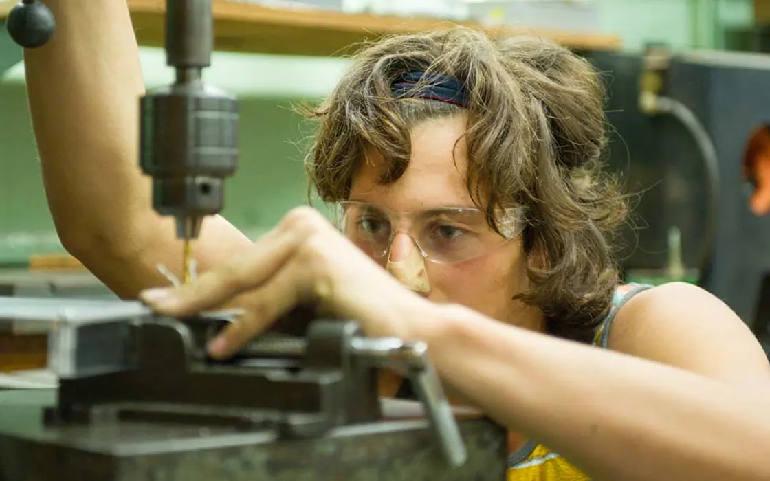 Danny Andreev works on his electric skateboard in the machine shop of SMC.