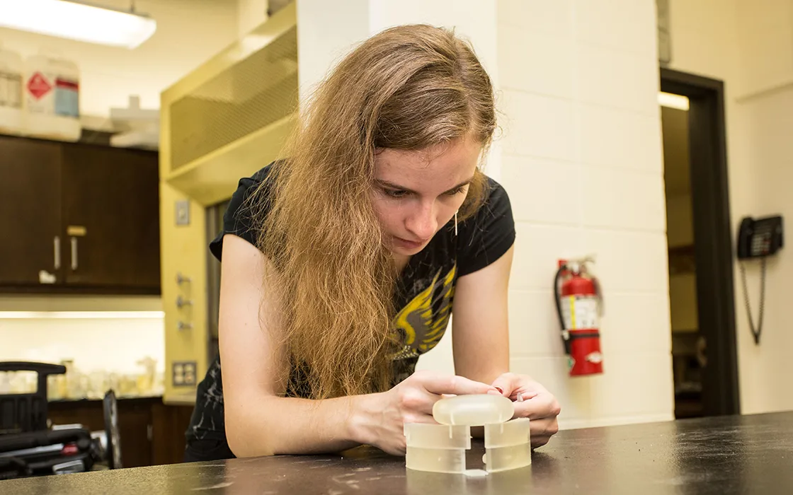 Student Klara Mendrisova in Biology Lab—using a 3D printer to make models of shark jaws for a research project.
