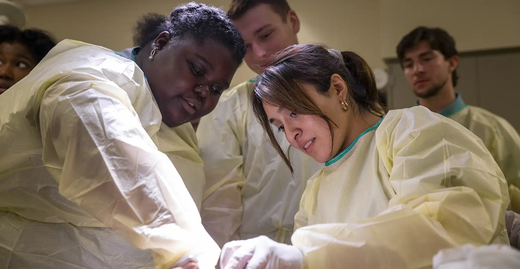 A group of students working in a surgery setting.