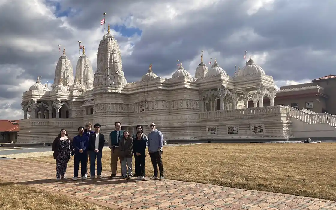 A Religious Studies class stands outside the BAPS Shri Swaminarayan Mandir of Chicago, Illinois.