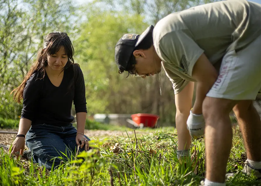 Two student volunteer at the Knox Farm