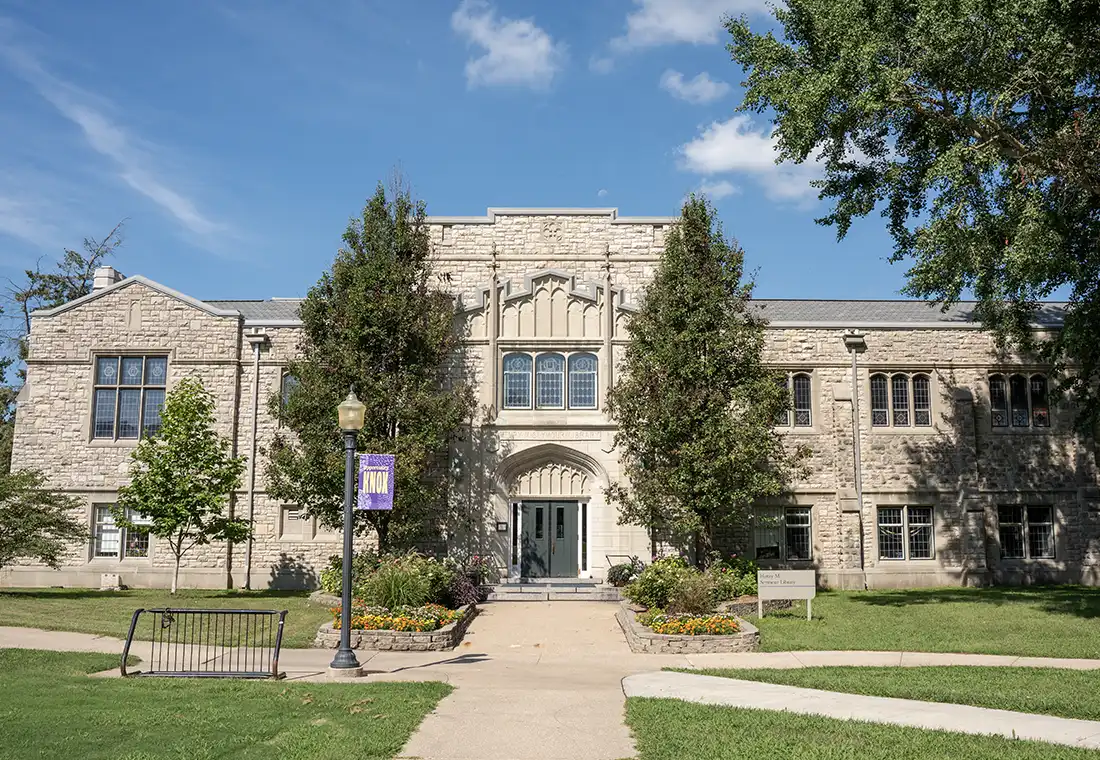 The front of Seymour Library with a sunny blue sky.