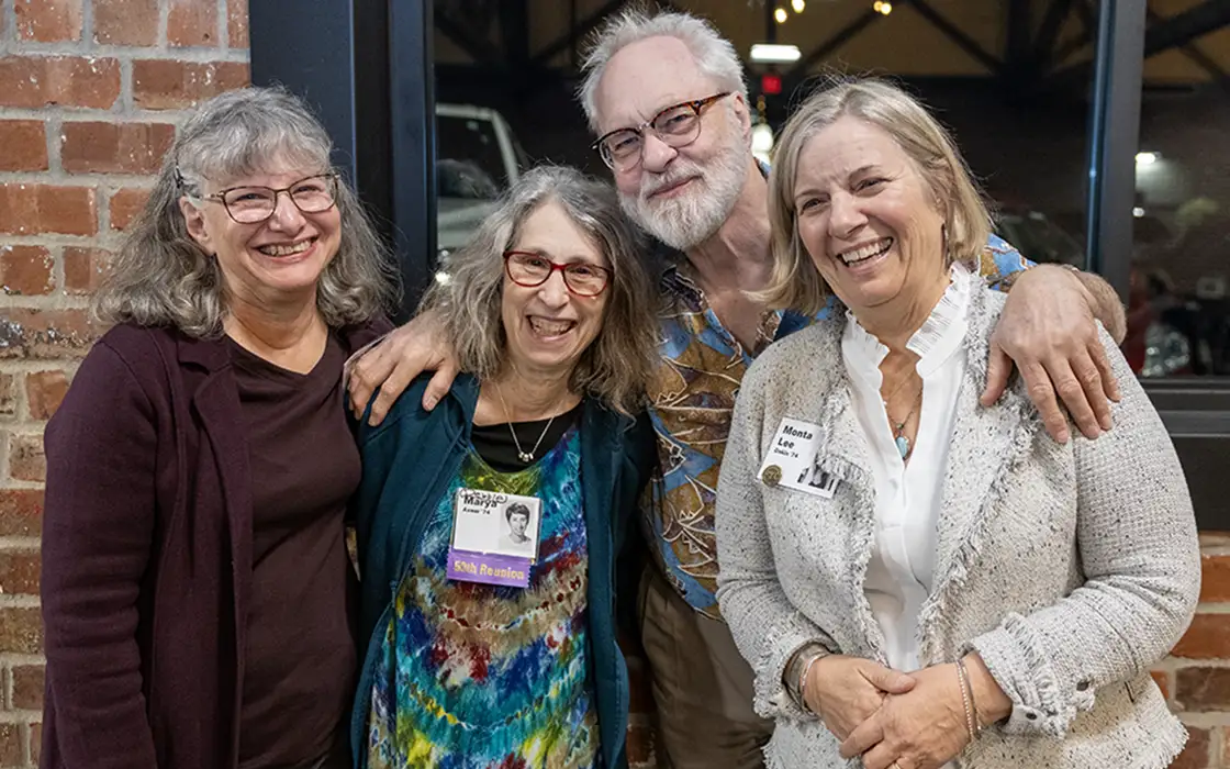 Four members of the Class of 1974 pose for the camera at Reunion.
