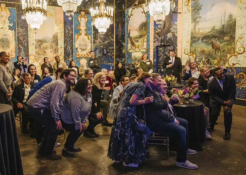 Members of Seattle Knox Club pose for a selfie during a reception. 
