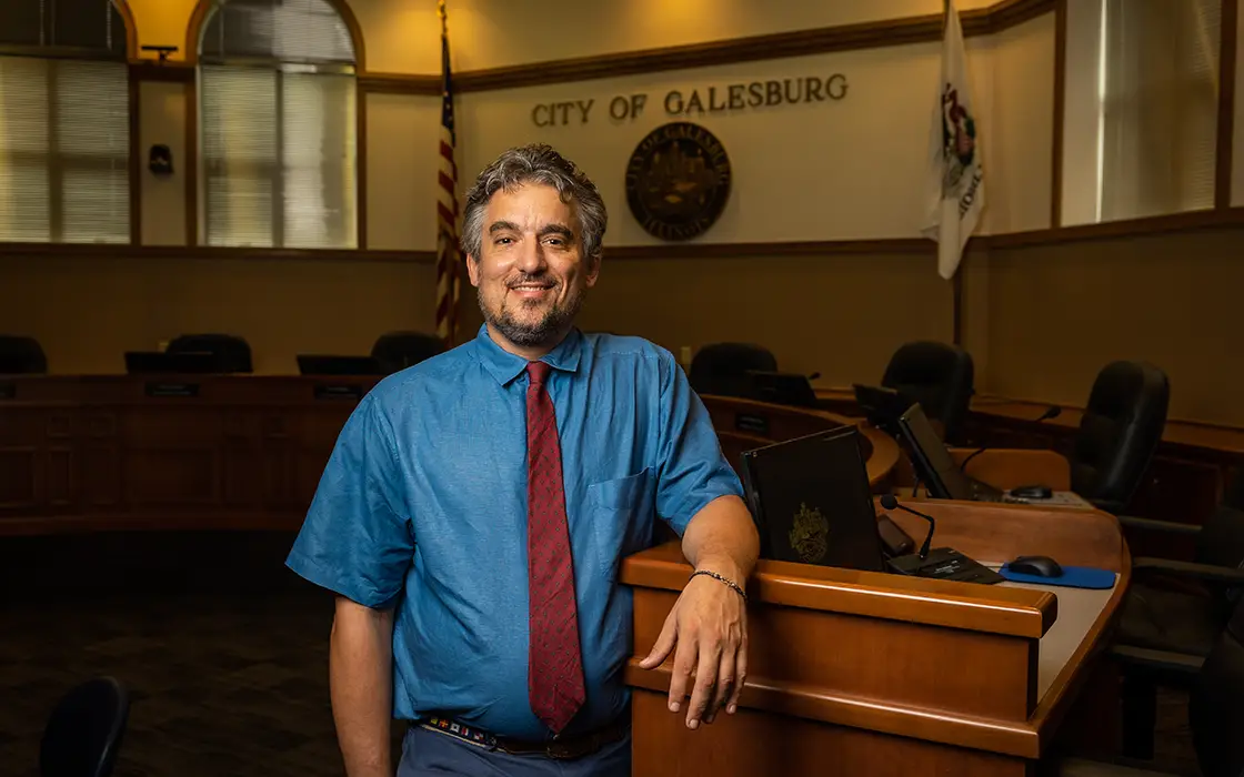 Galesburg mayor and Knox professor Peter Schwartzman standing in Galesburg's City Hall. 