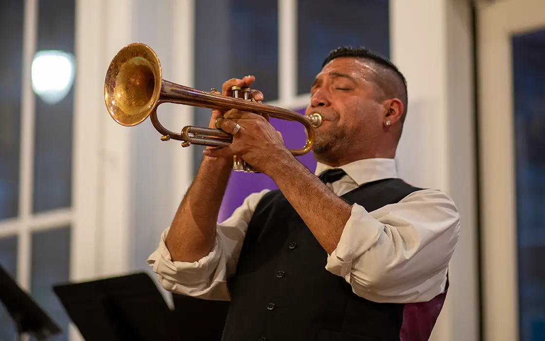 A man playing a trumpet.