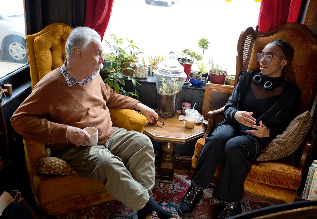 Two members talking at a local Galesburg coffee shop.