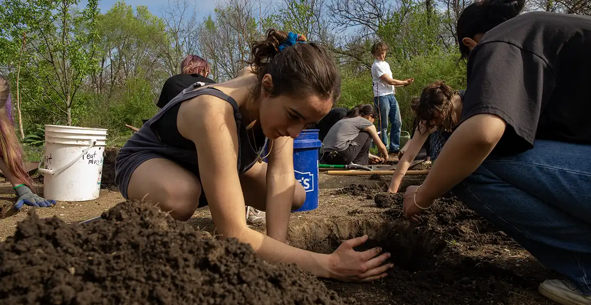 Students planting trees during Arbor Day.