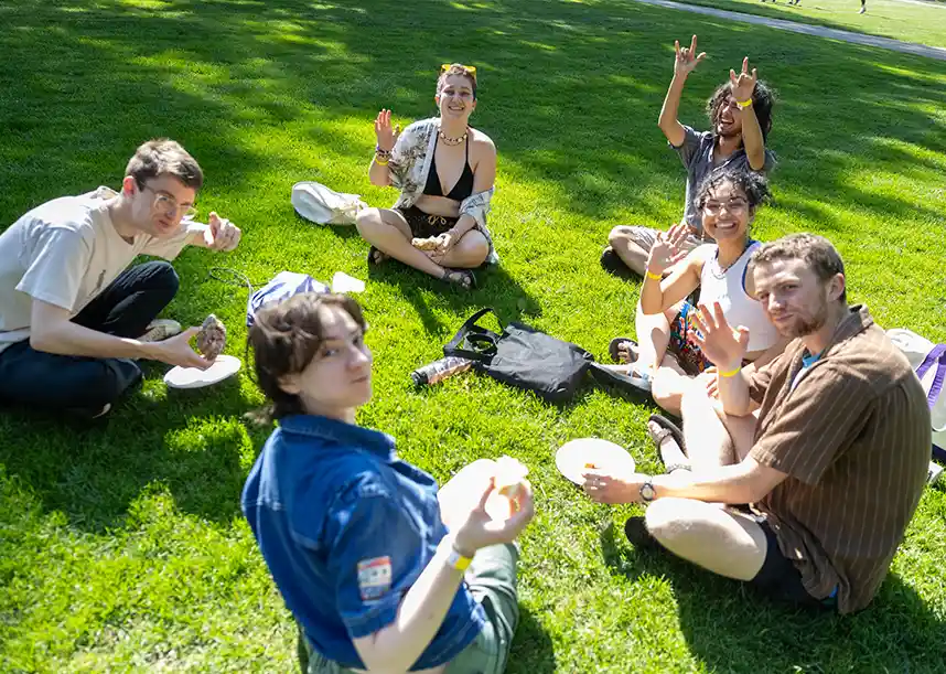 Students study in a circle on a Knox College Lawn.